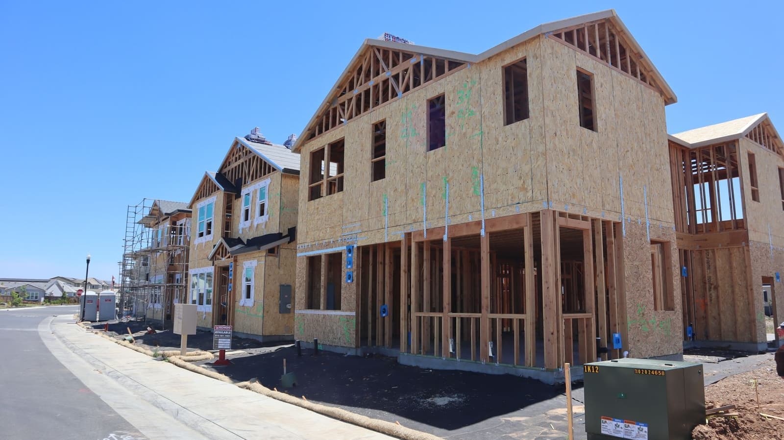 Row of new houses with wood framing
