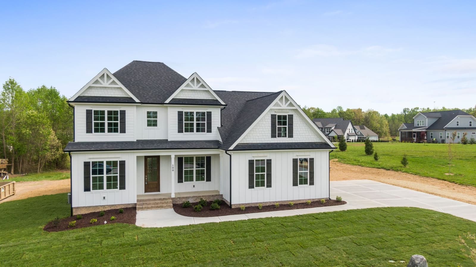 White house with dark shingle roof