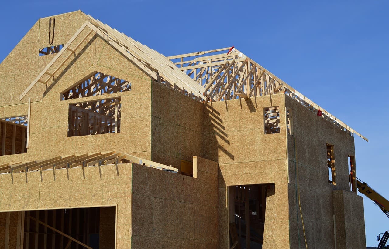 Wood framed house with roof trusses under construction