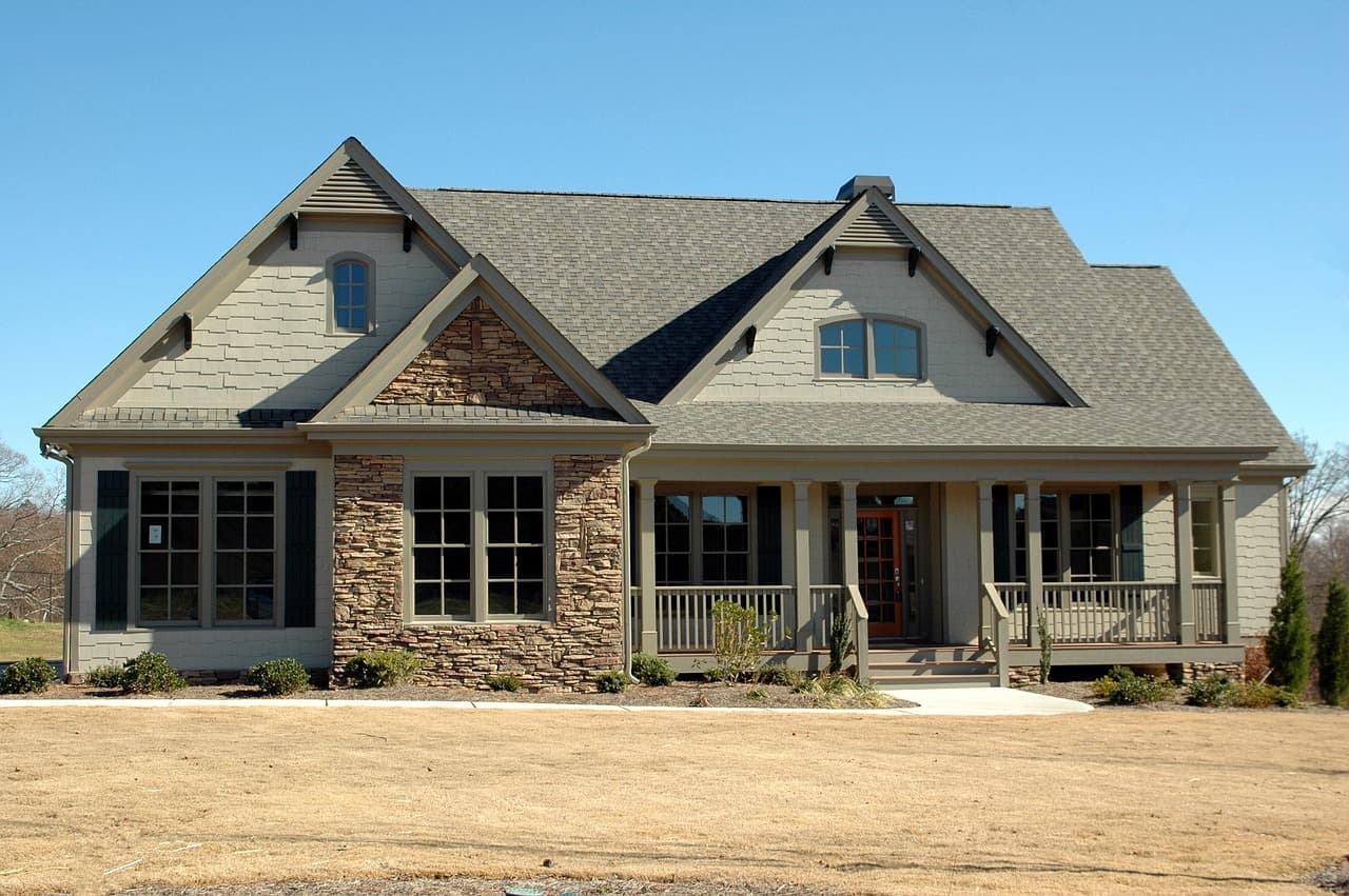 House with stone and shingle roof